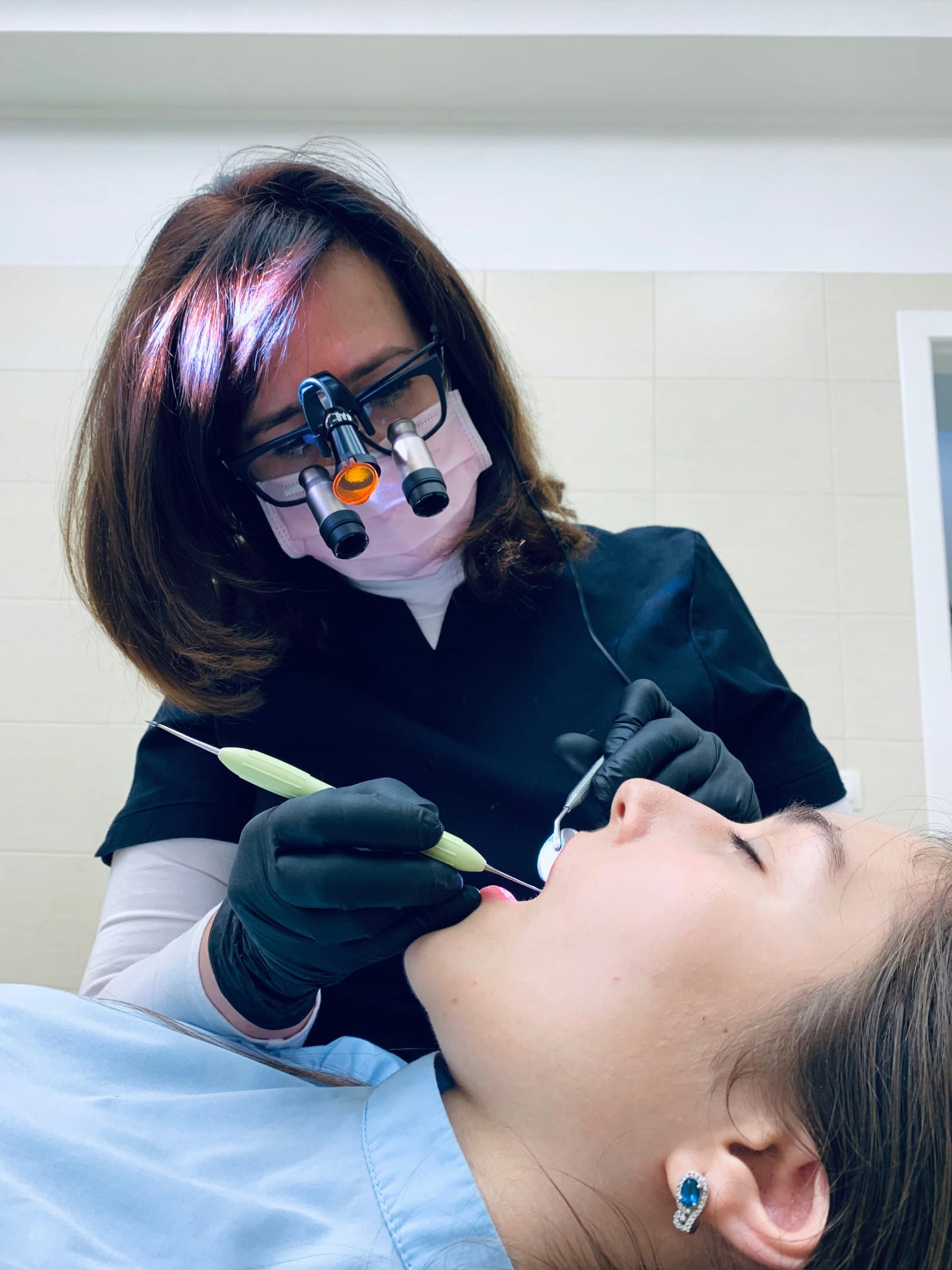 A dentist works with a patient