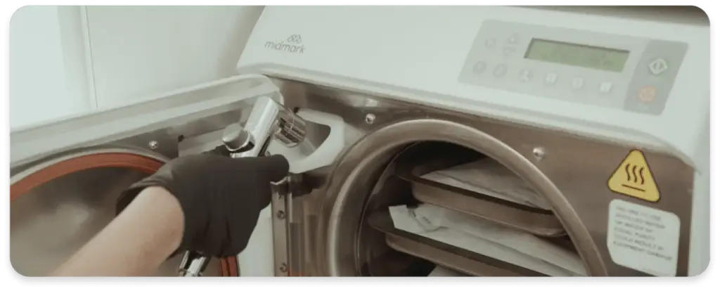 Dentist working with a Sterisil AC+ to purify the incoming tap water